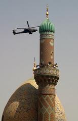 American military helicopter flying near a mosque in Baghdad Iraq