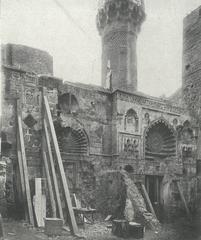 Aqmar mosque façade during restoration with removal of booths on the left