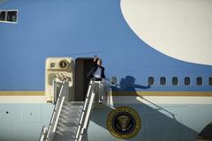 President Donald Trump waving to 114th Fighter Wing members before departure from Joe Foss Field