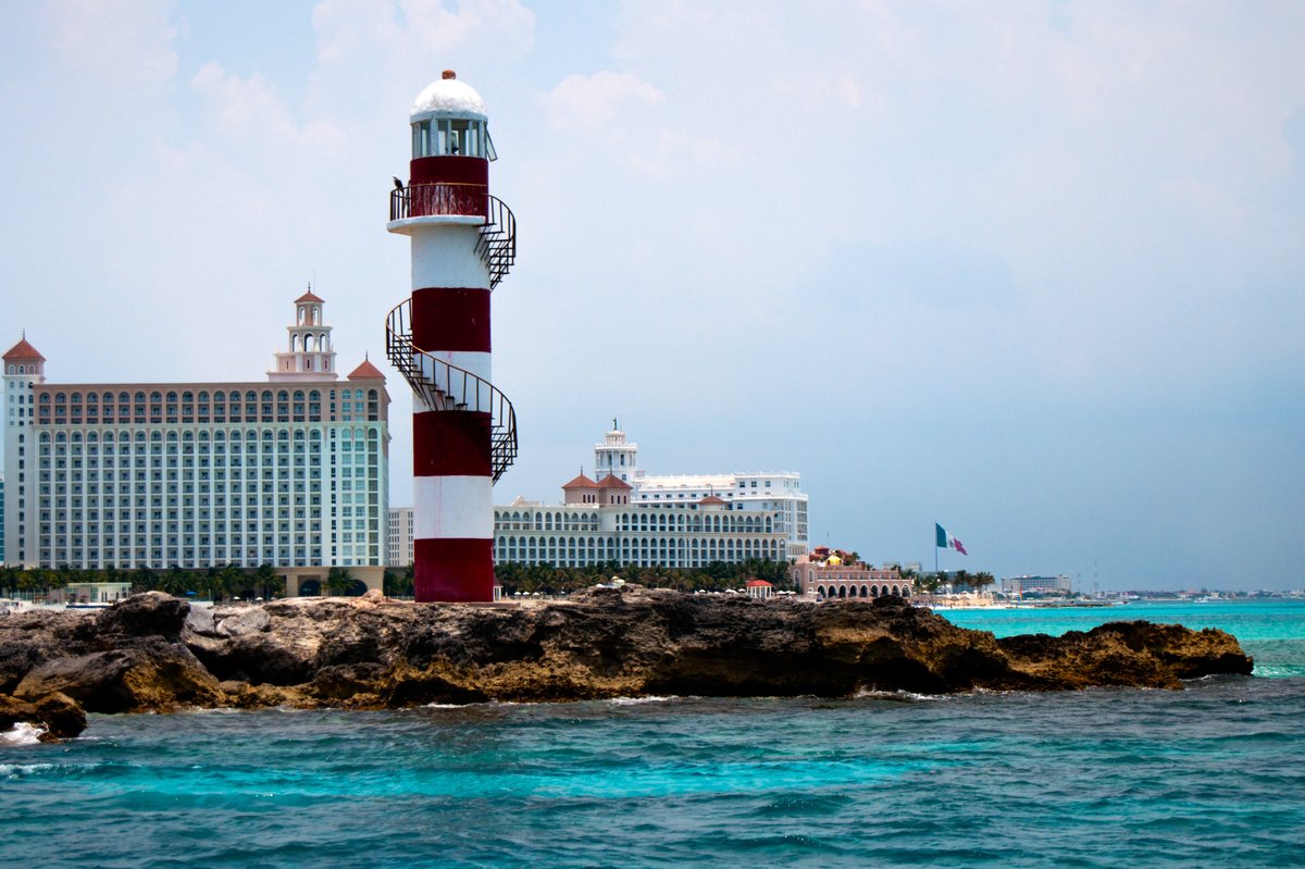 Punta Cancun Lighthouse in Cancun Mexico with ocean and sky background