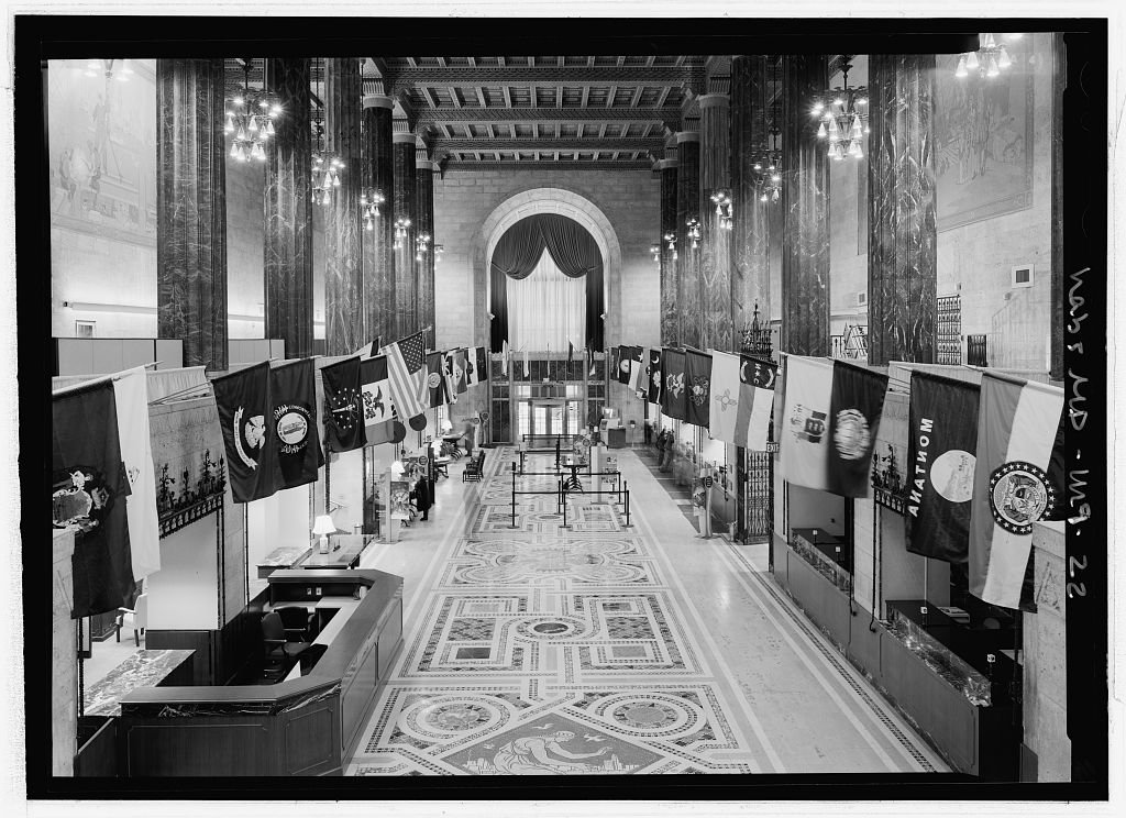 Interior of Baltimore Trust Company Building at 10 Light Street showing ornate mosaic floors, flags of US states, and ATM