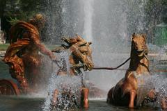 Sculpture of Apollo and his horses at the Apollo Fountain in the Gardens of the Palace of Versailles during Grandes Eaux