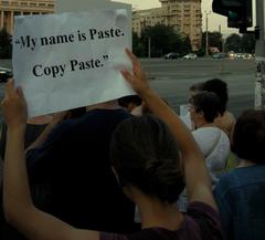 Protesters holding placards including one stating 'My name is Paste. Copy Paste' mocking Victor Ponta as a plagiarist during a demonstration against President Băsescu's impeachment on Victoriei Square, Bucharest