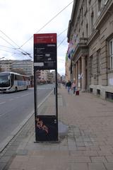 A panoramic view of Student Square in Belgrade with modern buildings and people walking