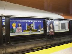 Mural artwork at Queen subway station in Toronto showing colorful abstract patterns across the tracks