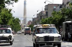 Ben Yehuda Street in Tel Aviv with Reading power station chimney in background