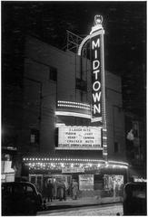 The Midtown Theatre illuminated at night in Toronto