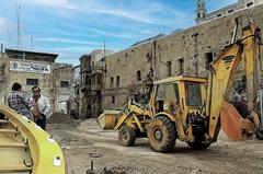 Port of Jaffa wharf under renovation with construction equipment and scaffolding