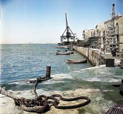 Historic view of Jaffa port wharf with boats docked, 1936