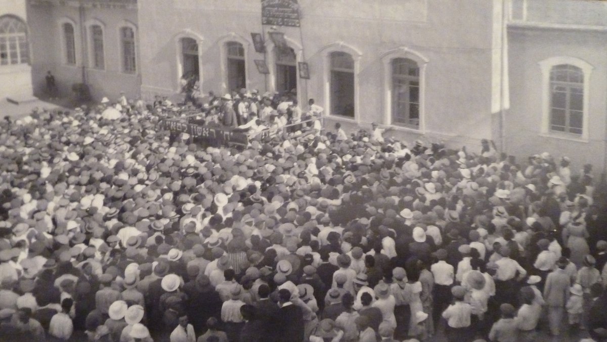 Writer Alexander Ziskin Rabinovitch giving a speech on 1st May at Herzelia Gymnasium courtyard in 1924