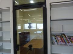 Migdal Shalom Library interior with bookshelves and reading area