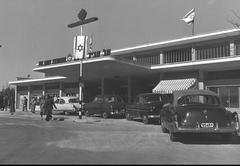 Arlozorov train station in Tel Aviv with trains and railway tracks under a large modern roof
