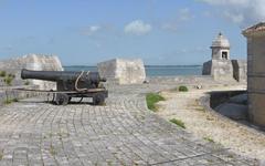 historic Fort Louvois firing platform with cannon and watchtower on rocky islet near Bourcefranc coast