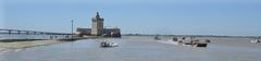Fishing boats returning at low tide in front of Fort Louvois in Bourcefranc le Chapus