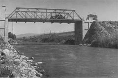 Bnot Yaakov Bridge over a river surrounded by rocky terrain and vegetation
