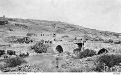 Australian Mounted Divisional Train crossing repaired bridge over the Jordan River near Benat Yakub, Palestine, 1918