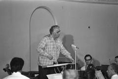 Composer Aram Khachaturian conducting the Amsterdam Philharmonic Orchestra during rehearsal at Felix Meritis Amsterdam in 1971