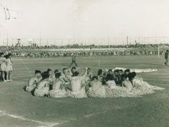Group of people standing on a sports field during the 2nd Maccabiah Games