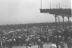Mass anti White Paper rally at Tel Aviv Stadium with large crowd holding banners