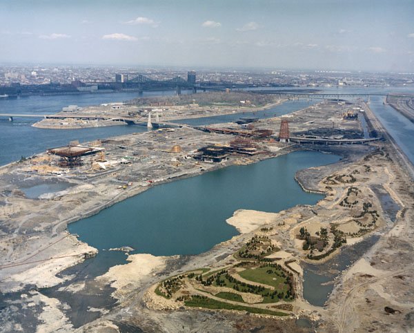 Aerial view of Expo 67 general site construction with cranes and buildings