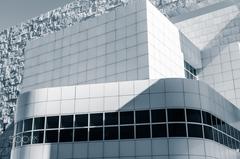 Black and white abstract architectural details of The Getty museum in Los Angeles with curves, lines, windows, and shadows