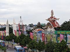 Main entrance of Suoi Tien Park with decorative sculptures and colorful architecture