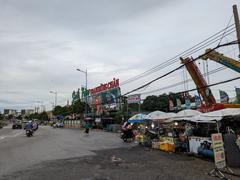 Main entrance of Suoi Tien Park with colorful architectural structures and signage under a blue sky