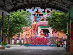 Entrance gate of Suoi Tien Park with traditional dragon sculptures in July 2023