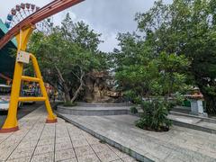 Colorful traditional Vietnamese dragon sculpture with water fountain at Suoi Tien Park in July 2023