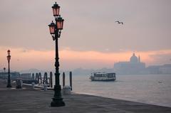 View of Canale della Giudecca canal in Venice with boats and historic buildings
