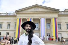 Colorful LGBTIQ+ pride flags displayed at Casa de Nariño during Día LGBTIQ+ celebration