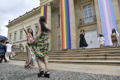 Colorful flag and people celebrating LGBTIQ+ Day at Casa de Nariño