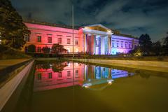 LGBTIQ month commemoration event with colorful pride flags and a diverse crowd