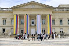 Pride parade at Casa de Nariño celebrating Día LGBTIQ+ with colorful flags and enthusiastic participants