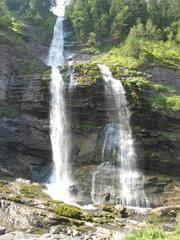 Waterfall of le Rouget near Sixt-Fer-à-Cheval in Haute-Savoie, France surrounded by rocks and lush greenery
