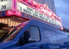 Team Abacus parked outside the historic Castro Theater in San Francisco on a bright day