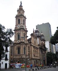 Exterior view of the Old Cathedral of Rio de Janeiro with colonial architecture and a clear blue sky