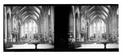 Interior of Sant Joan Cathedral with intricate architectural details and colorful stained glass windows