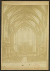 Interior of Cathédrale Saint-Jean-Baptiste de Perpignan showing nave towards choir with organ, pulpit, and main altar retable