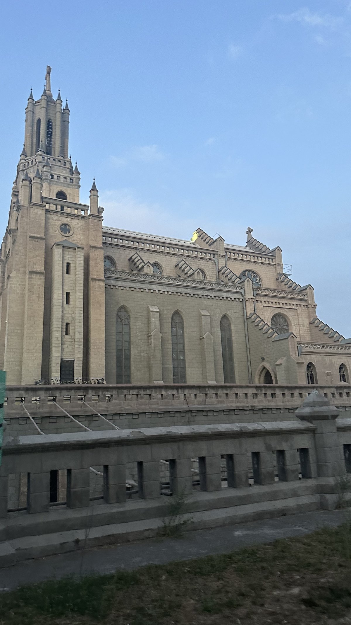 Muqaddas Yurak Sobori cathedral in Tashkent with its distinctive architecture under a clear blue sky
