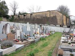 Alley and fortification wall at the south of the old cemetery in Loyasse