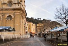 Cours Saleya market street in Nice with colorful buildings and street lamps