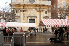 Le Cours Saleya flower market in Nice, France with vibrant flowers and colorful umbrellas