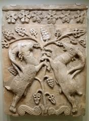 Sasanian period relief plaque featuring confronted ibexes, stucco with traces of polychrome paint