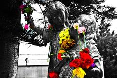 Cemetery statues with flowers in Bogota