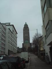 View looking up Siltasaarenkatu street towards Kallio Church on a cloudy day