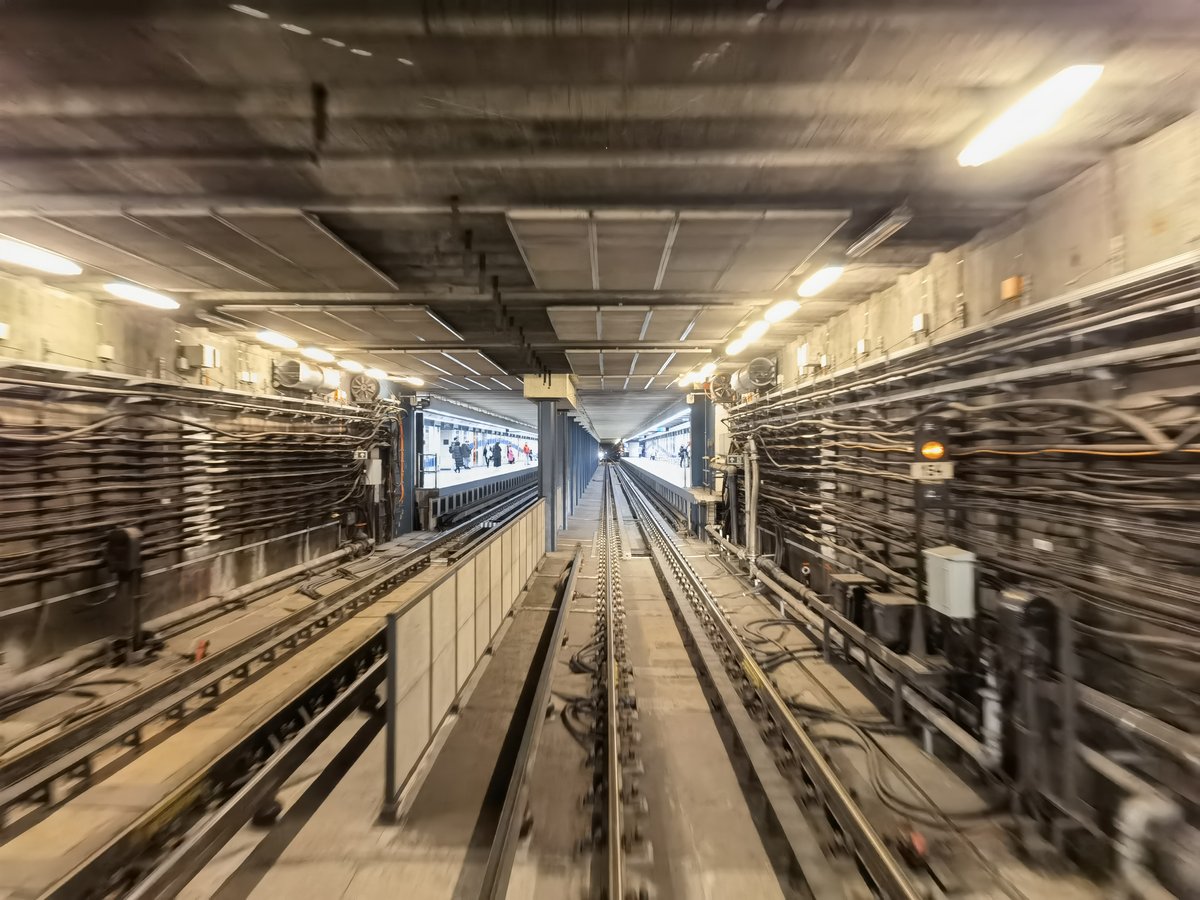 Budapest Gyöngyösi utca M3 metro station platform with passengers and trains