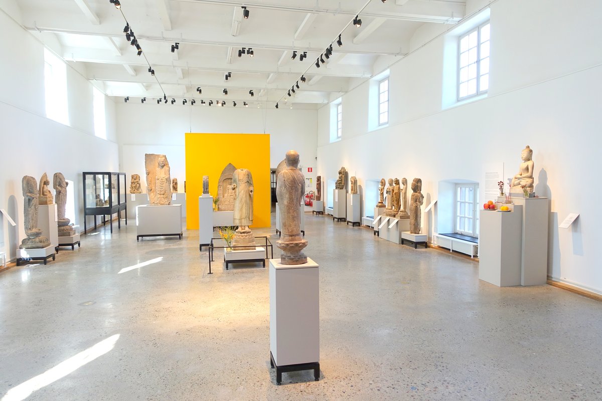 Interior sculpture hall at the Östasiatiska museet in Stockholm featuring historical Asian artworks