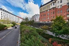 Baana cycling and pedestrian path in Helsinki surrounded by greenery and residential buildings