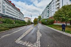 Baana pedestrian and bicycle path in Helsinki surrounded by trees and people walking